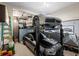 Garage equipped with car lift for convenient multi-car storage and a clean, organized space at 8172 S Langdale Way, Aurora, CO 80016