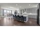 Gourmet kitchen featuring a large island, modern appliances, and a breakfast bar with seating at 8172 S Langdale Way, Aurora, CO 80016