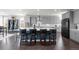 Spacious kitchen featuring a large island, modern appliances, ample cabinet space, and a dining area at 8172 S Langdale Way, Aurora, CO 80016