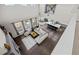 Aerial view of open-concept living room, kitchen, and dining area with abundant natural light at 8172 S Langdale Way, Aurora, CO 80016