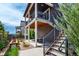 Exterior view of a backyard featuring a patio, upper deck, and landscaping at 8958 Southurst St, Littleton, CO 80129