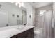 Bright bathroom features a shower/tub and single sink vanity at 8958 Southurst St, Littleton, CO 80129
