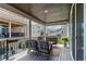 Relaxing covered deck with comfortable seating and stylish outdoor decor at 8958 Southurst St, Littleton, CO 80129