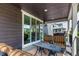 Cozy covered deck showcasing outdoor seating and peaceful ambiance at 8958 Southurst St, Littleton, CO 80129