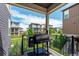 Inviting covered deck with a grill and views of the surrounding neighborhood at 8958 Southurst St, Littleton, CO 80129