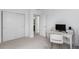 Bright home office features a desk and opens to the hallway and the bathroom at 8958 Southurst St, Littleton, CO 80129