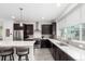 Bright kitchen with quartz countertops, stainless steel appliances, and a functional layout at 8958 Southurst St, Littleton, CO 80129