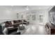 Bright living room with large windows and comfortable seating area at 8958 Southurst St, Littleton, CO 80129