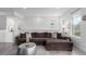 Well-lit living area with a comfortable sectional sofa and modern decor at 8958 Southurst St, Littleton, CO 80129