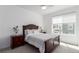 Comfortable main bedroom features plush carpet, ample natural light, and stylish furnishings at 8958 Southurst St, Littleton, CO 80129