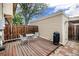 Wooden deck with table and chairs, and grill at 1282 S Troy St, Aurora, CO 80012