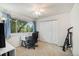 Bright bedroom with a desk, chair, and large closet at 1282 S Troy St, Aurora, CO 80012