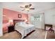 Spacious bedroom with a queen-size bed and ceiling fan at 1282 S Troy St, Aurora, CO 80012