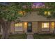 Charming townhome featuring a brick facade and manicured lawn at 1282 S Troy St, Aurora, CO 80012