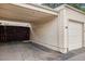 Single car garage with carport and wooden fence at 1282 S Troy St, Aurora, CO 80012