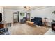 Cozy living room featuring a fireplace, comfy seating, and a ceiling fan at 1282 S Troy St, Aurora, CO 80012