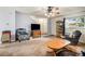 Spacious living room with a staircase, comfortable seating, and a large TV at 1282 S Troy St, Aurora, CO 80012