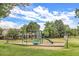 playground with swings and slides at 1282 S Troy St, Aurora, CO 80012