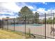 Community pool with surrounding fence and patio area at 1282 S Troy St, Aurora, CO 80012