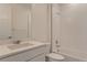 A pristine bathroom with a shower and bath combination, clean white tile, and a white vanity at 2525 Lupton Ln, Lafayette, CO 80026