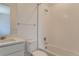 Bright white bathroom with tile surround tub, shower and vanity at 2525 Lupton Ln, Lafayette, CO 80026