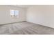 Bright bedroom featuring neutral walls, new carpet and ample sunlight for a calm and welcoming space at 2525 Lupton Ln, Lafayette, CO 80026