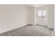 Large bedroom with a lot of natural light and neutral carpeting and walls create a blank canvas for decor at 2525 Lupton Ln, Lafayette, CO 80026