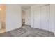 This bedroom features plush gray carpet and a closet with paneled doors at 2525 Lupton Ln, Lafayette, CO 80026
