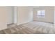 This bedroom has neutral carpet and a large window at 2525 Lupton Ln, Lafayette, CO 80026