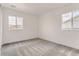 A spacious bedroom featuring neutral walls and carpeting, bathed in natural light from the large windows at 2525 Lupton Ln, Lafayette, CO 80026