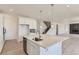 Bright, open kitchen featuring a large island with seating and stainless steel appliances at 2525 Lupton Ln, Lafayette, CO 80026