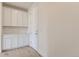 Mud room with wood-look floors, storage cabinets and a utility closet at 2525 Lupton Ln, Lafayette, CO 80026