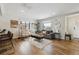 Bright living room features an open floor plan, neutral paint, and hardwood floors at 2222 Galena St, Aurora, CO 80010