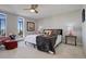 Bright bedroom with ceiling fan, carpet, and a large window with city views at 3131 E Alameda Ave # 1003, Denver, CO 80209