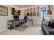 Bedroom with cozy seating area, desk area, and guitars on the wall at 3131 E Alameda Ave # 1003, Denver, CO 80209
