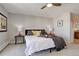 Comfortable bedroom with neutral walls, carpet, and large window overlooking the city at 3131 E Alameda Ave # 1003, Denver, CO 80209