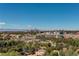 Panoramic cityscape view over treetops with the city skyline in the distance at 3131 E Alameda Ave # 1003, Denver, CO 80209