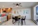 Dining area with modern table and chairs, adjacent to a kitchen bar at 3131 E Alameda Ave # 1003, Denver, CO 80209