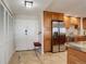 Entrance and kitchen featuring tile floors, stainless steel appliances, and ample cabinetry at 3131 E Alameda Ave # 1003, Denver, CO 80209