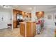 Beautiful kitchen features stainless steel appliances, tile floor and backsplash, plus bar seating at 3131 E Alameda Ave # 1003, Denver, CO 80209