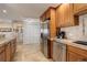 Open kitchen with stainless steel appliances and granite countertops is ready for your personal touch at 3131 E Alameda Ave # 1003, Denver, CO 80209