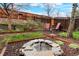 A backyard oasis with terraced levels, garden, and a stone fire pit at 21733 Saddlebrook Dr, Parker, CO 80138