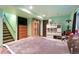 Spacious basement bedroom with tiled floors, comfortable bedding, and ample storage space at 21733 Saddlebrook Dr, Parker, CO 80138