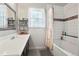 Well-lit bathroom with a large mirror, vanity, and tub/shower with mosaic tile accents at 21733 Saddlebrook Dr, Parker, CO 80138