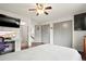 Spacious bedroom with hardwood floors, a large window, and ample closet space at 21733 Saddlebrook Dr, Parker, CO 80138
