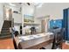 Open dining area adjacent to the living room, featuring a staircase and ample natural light, creating an inviting atmosphere at 21733 Saddlebrook Dr, Parker, CO 80138