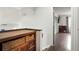 Hallway with hardwood floors, built-in storage, and access to additional rooms at 21733 Saddlebrook Dr, Parker, CO 80138