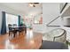 Spacious living and dining areas featuring hardwood floors, high ceilings, and a staircase leading to the upper level at 21733 Saddlebrook Dr, Parker, CO 80138