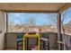 Covered balcony with seating provides a pleasant space to relax and enjoy the outdoor views at 1243 Gaylord St # 410, Denver, CO 80206