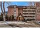 Charming brick condo building with balconies and attractive architectural details at 1243 Gaylord St # 410, Denver, CO 80206
